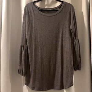Grey Blouse w/ bell sleeves at the bottom.